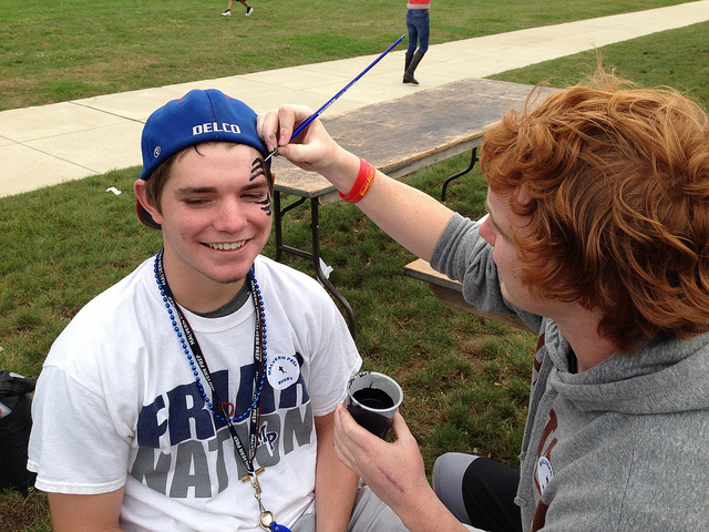 PJ Murphy painting faces at homecoming